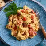Scrambled Eggs With Greek Sausage, Tomatoes, And Cheese Recipe