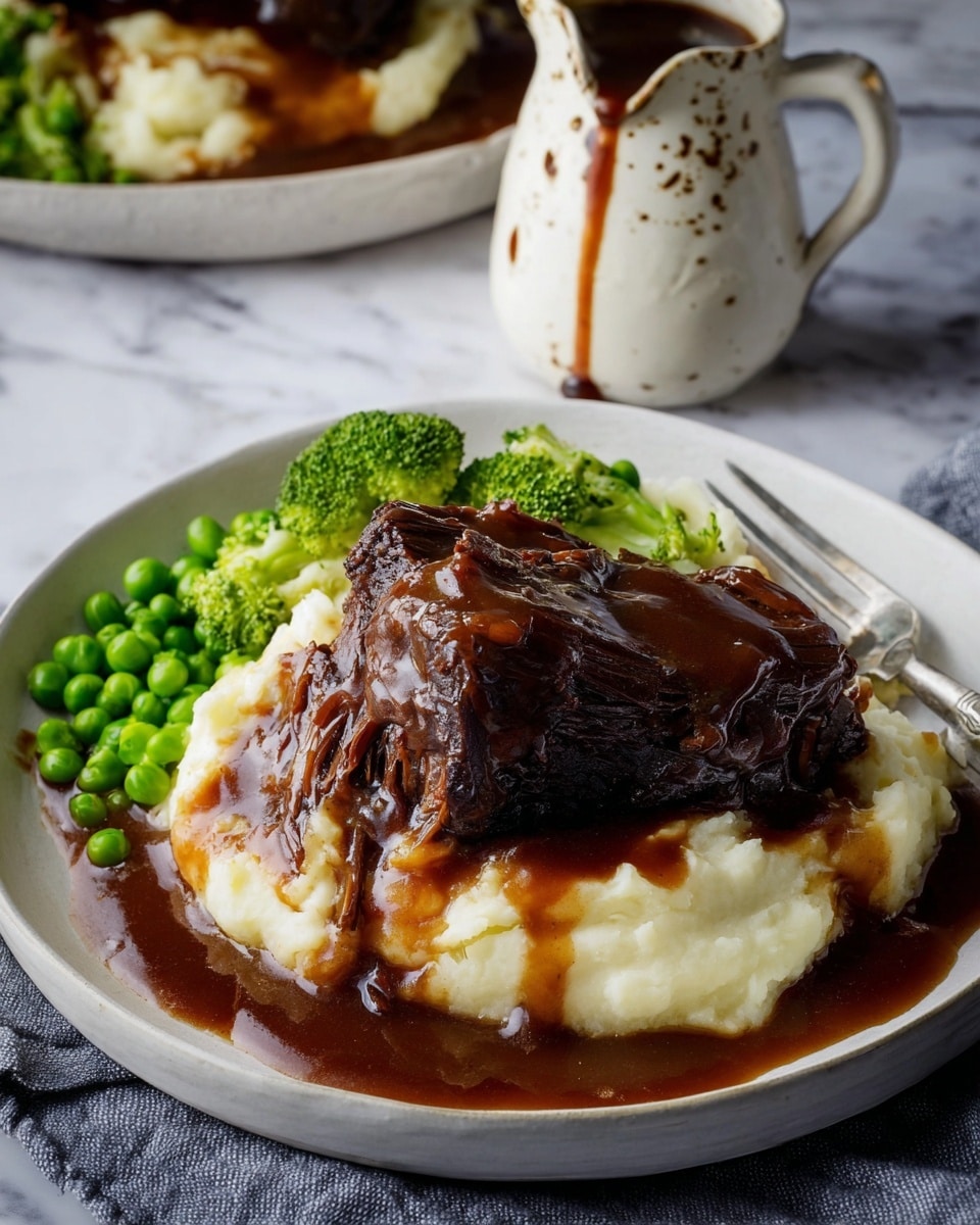 A white bowl filled halfway with bright yellow rice, showing fluffy grain texture, topped with scattered fresh green cilantro leaves. Next to the rice, there is a thick reddish-brown curry with chunks of cooked meat and green bell pepper strips. On top of the curry, thin slices of purple onion and more cilantro leaves are placed, adding a fresh touch. Two pieces of flatbread with toasted brown spots rest against the rice on the side of the bowl. In the blurred background, another white bowl contains a fresh salad with red tomato, green cilantro, and purple onion on a white marbled surface. Photo taken with an iphone --ar 4:5 --v 7